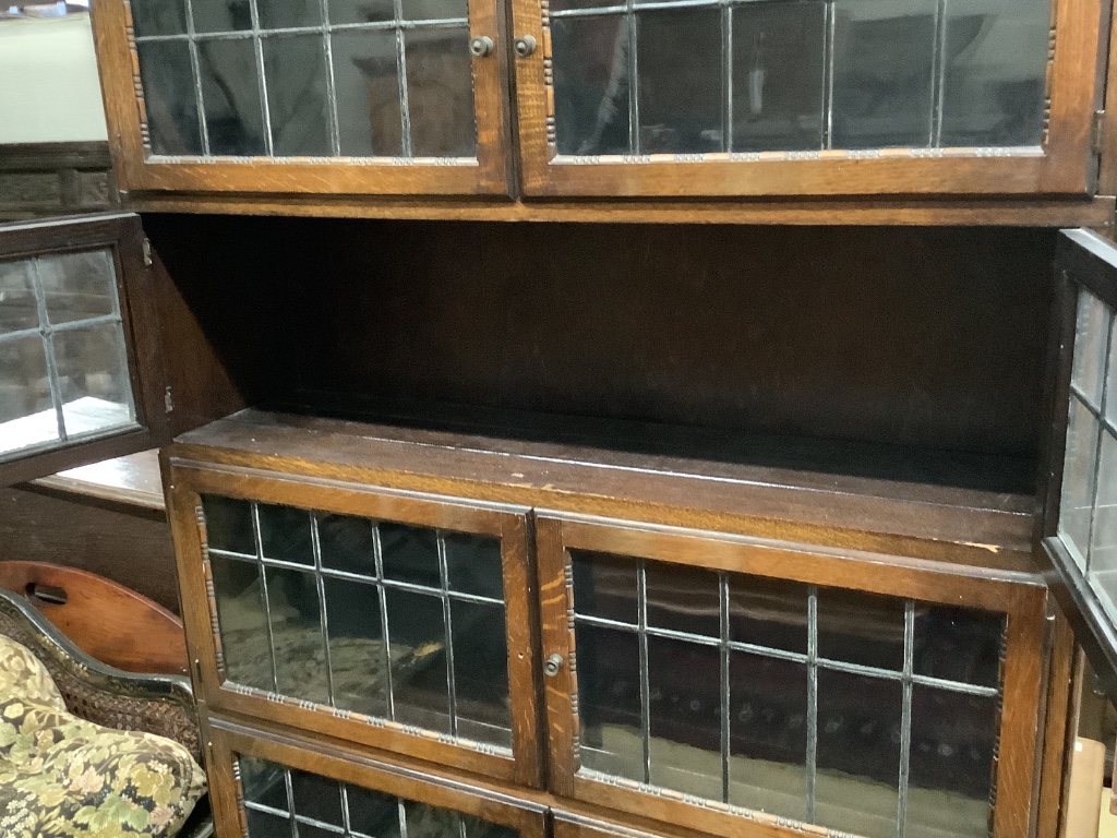 A six tier oak stacking modular bookcase, in the Globe Wernicke style, width 89cm depth 28cm height 198cm